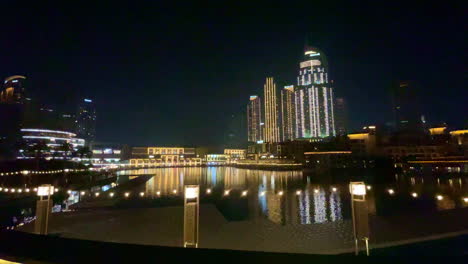 Colorful-city-lights-reflected-in-water-Burj-Khalifa-lake-Dubai-United-Arab-Emirates-4K