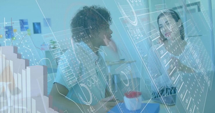 Colleagues Collaborating on Data Analysis in Modern Office