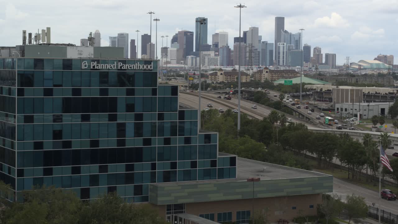 Drone view of Planned Parent Hood building and downtown Houston, Texas