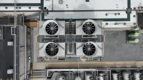 rotating propeller of air conditioner on roof of factory building