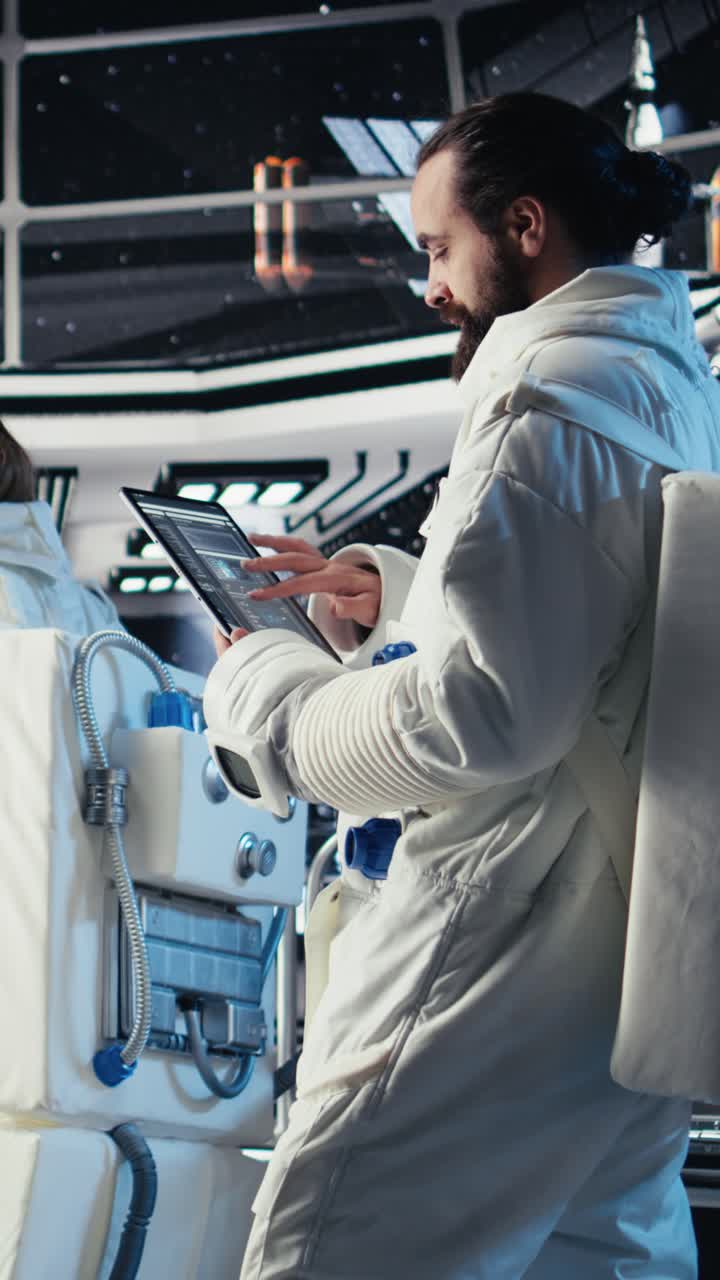 Vertical video Portrait of joyous cosmonaut putting helmet on, preparing for mission launh