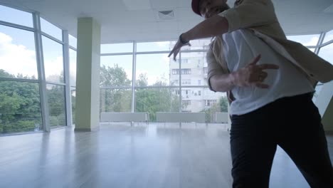 man breakdancing in modern studio