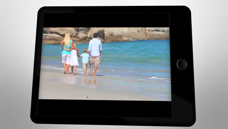 animated tablet computer displaying videos about family having fun