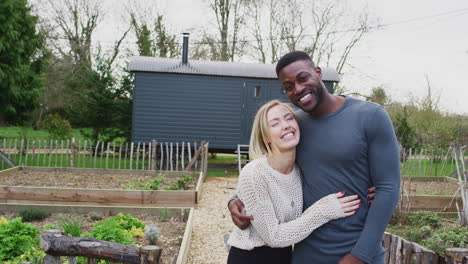 outdoor portrait of couple spending vacation in eco lodge