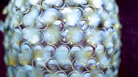 a close-up view of a glowing, luxurious crystal chandelier