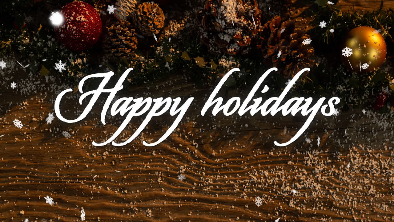 Animation of happy holidays text over snow falling on christmas decorations background
