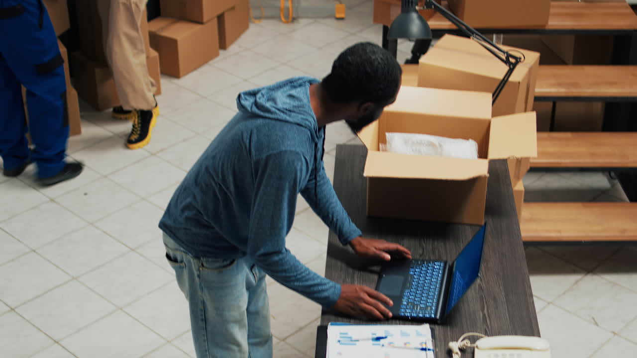 Warehouse workers packing boxes for shipment