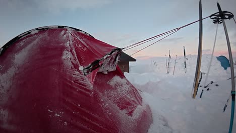 steam emits from frosty red tent in northern winter camp snow scene
