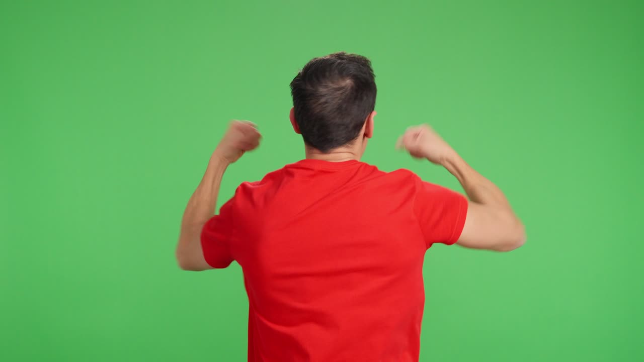 Man with his back turned celebrating and cheering