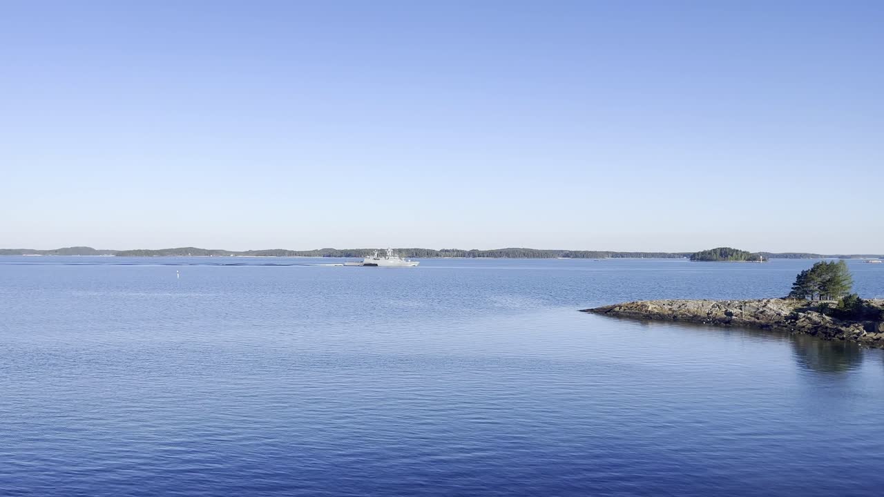 German navy corvette making way ahead in Finnish archipelago. Calm sunny weather