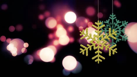 los adornos de copos de nieve de navidad se balancean en el fondo de bokeh archivo de bucle
