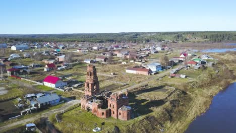 aerial view of a ruined church in a russian village