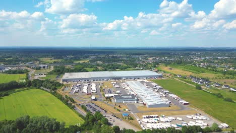 Aerial-view-of-warehouse-storages-or-industrial-factory-or-logistics-center-from-above