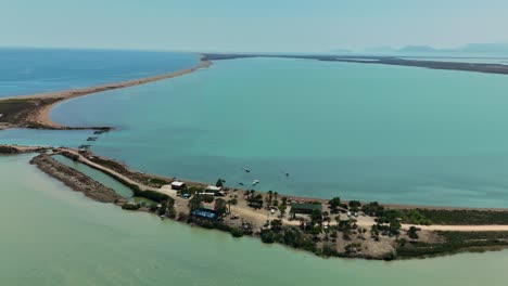 aerial view of tranquil beach with serene blue water and distant horizon