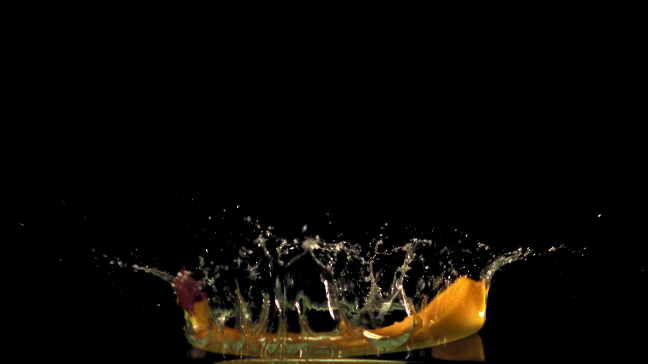 Slow Motion Banana Dropping into Water with a Splash