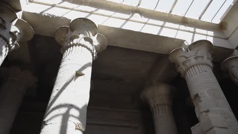 interior of ancient egyptian temple dramatic shadows cast on the column