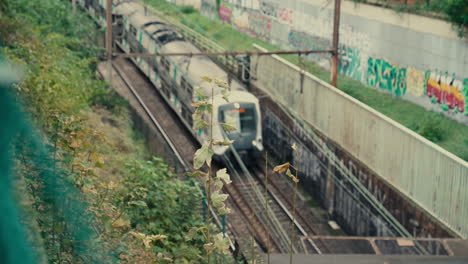 4k slow motion shot of rer train approaching, suburban railway, vincennes, île-de-france