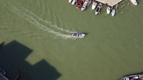 boat turning in grand canal of venezia, aerial top down view
