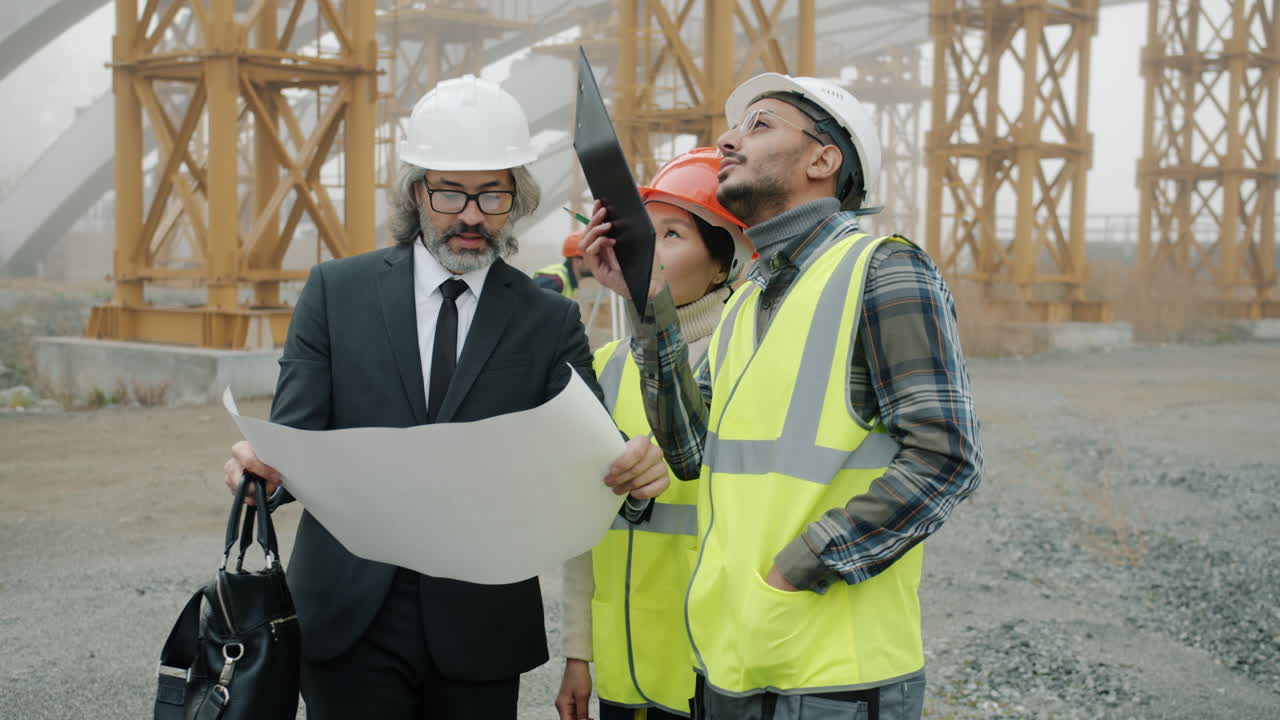 Construction Team Reviewing Plans on a Site