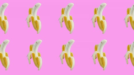 two lines with many bananas animated in different direction on a pink background. seamless looping of realistic 3d tropical food. minimal motion design art