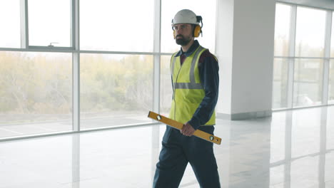 construction worker inspecting a commercial building