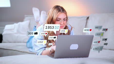 Young-woman-relaxed-on-her-sofa-visiting-social-media-sites-and-apps-on-her-notebook-computer