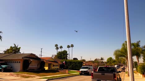 helicopter circling over some houses in a southern california neighborhood