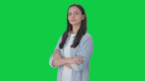 Portrait-of-Confident-Indian-girl-standing-crossed-hands-Green-screen