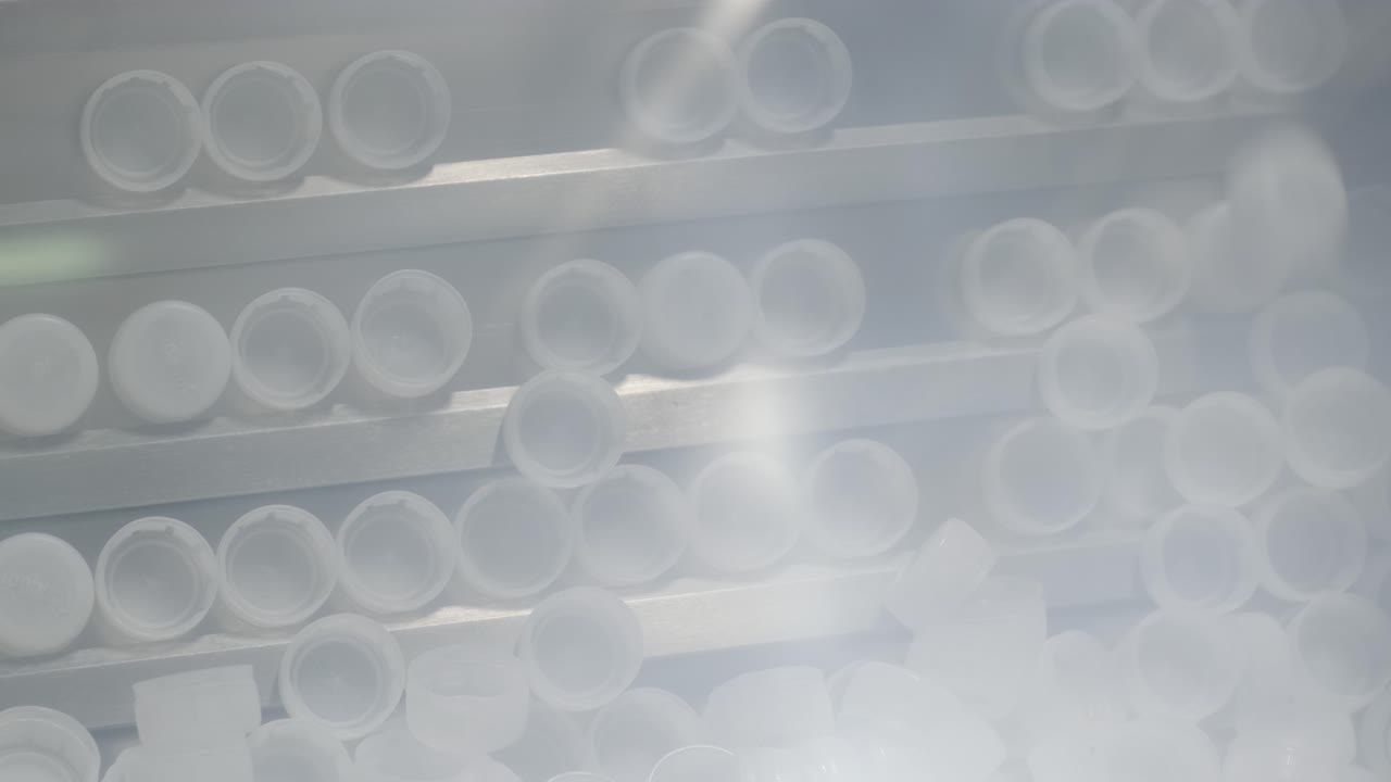 Bottle caps in a modern beverage plant