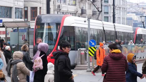 busy city street scene with modern tram in istanbul, turkey