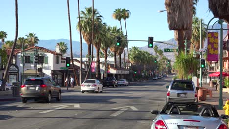 good establishing shot of palm canyon drive and traffic in downtown palm springs california 1