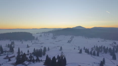 Aerial-view-of-the-tourist-sport,-Ski-area-and-recreational-resort-on-the-mountain-Jahorina-at-sunset,-Bosnia-and-Herzegovina