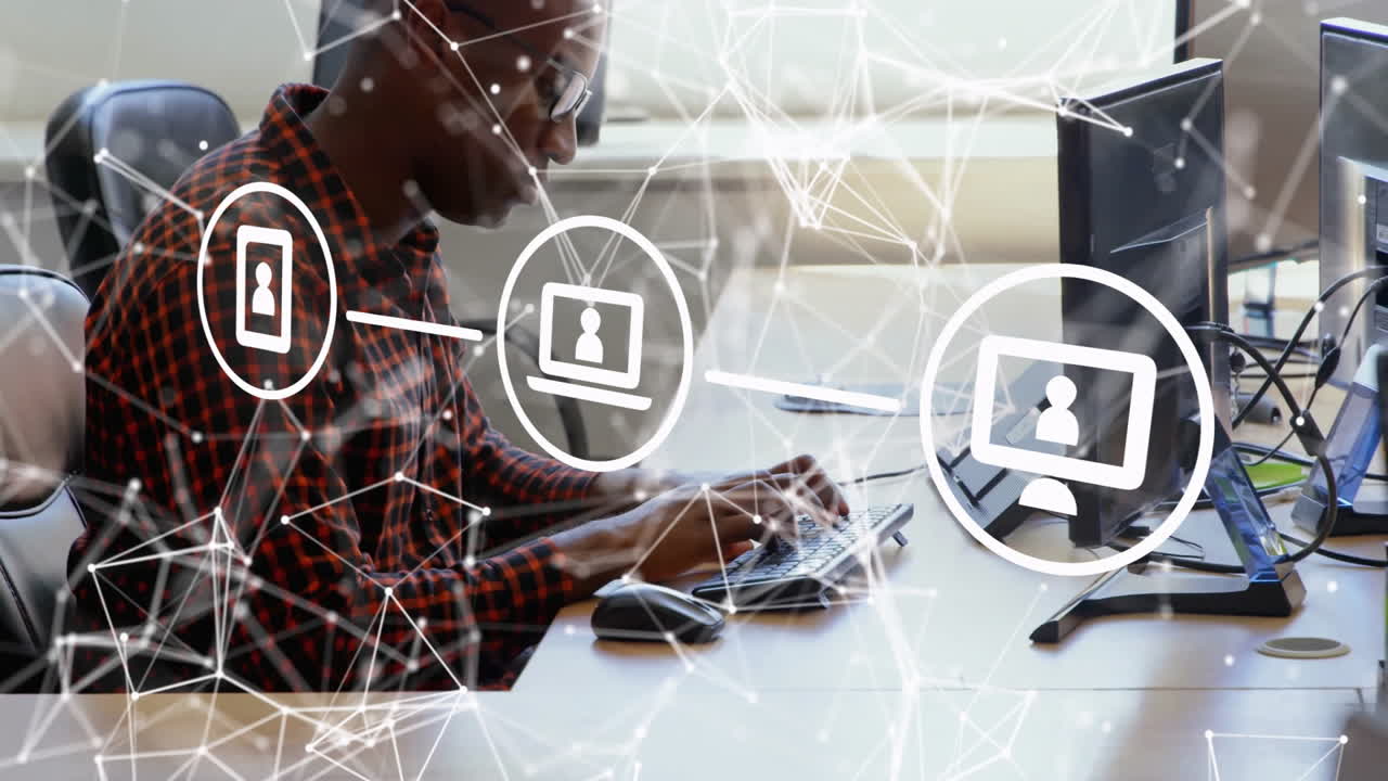 Working on laptop, man using animation for digital network connections in office