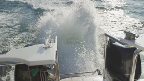 close up detail of the string of water going up under an engine