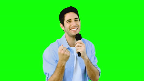 Man-singing-into-microphone-with-emotion-on-green-screen