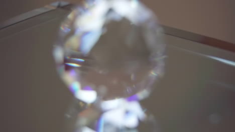 macro rack focus onto crystal on reflective glass