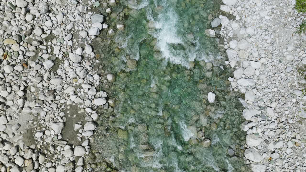 Stream Flowing Over Rocks And Pebbles In Silvaplana, Switzerland - Top View