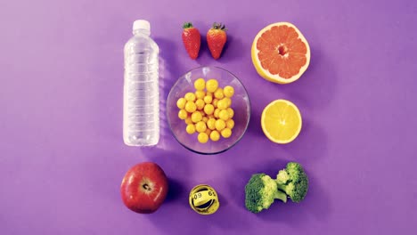 water bottle, fruits, vegetable and measuring tape