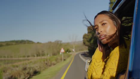 young woman on a road trip in pick-up truck