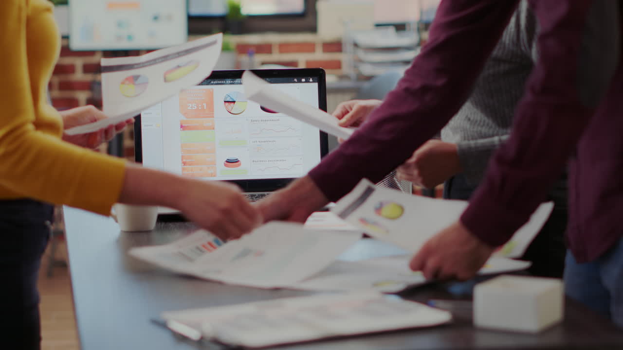 Business people looking at project reports on files