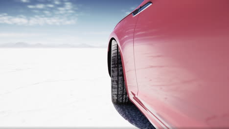 red car on a salt flat