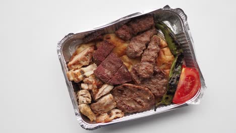 turkish mixed grill in a takeaway box