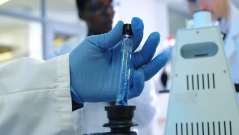 scientist holding test tube with solution 4k