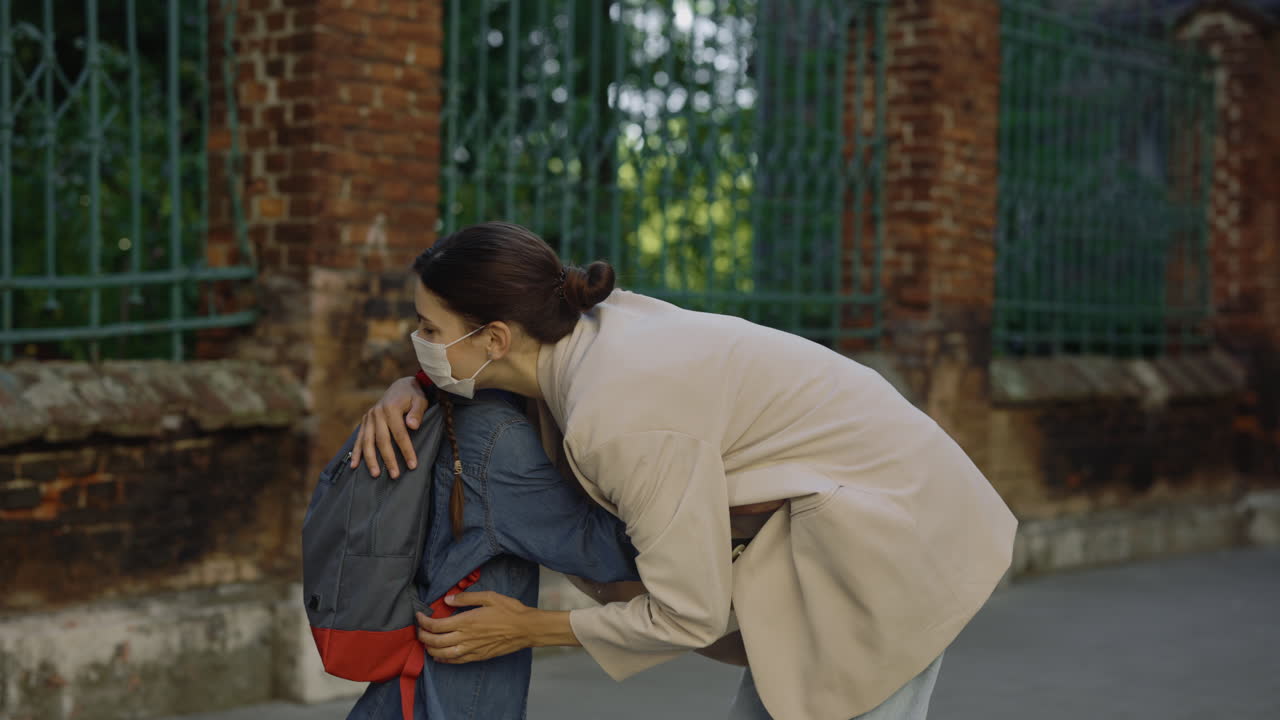 Mother and Daughter Greeting at School