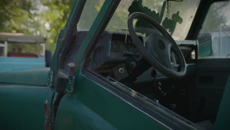 old and rusty abandoned off road car with door falling apart