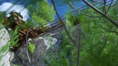 abandoned mining equipment on a cliffside