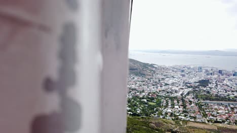 cityscape view of cape town from cableway going up to table mountain