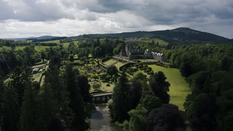 establishing aerial view of drummond castle gardens and its manicured lawn in scotland