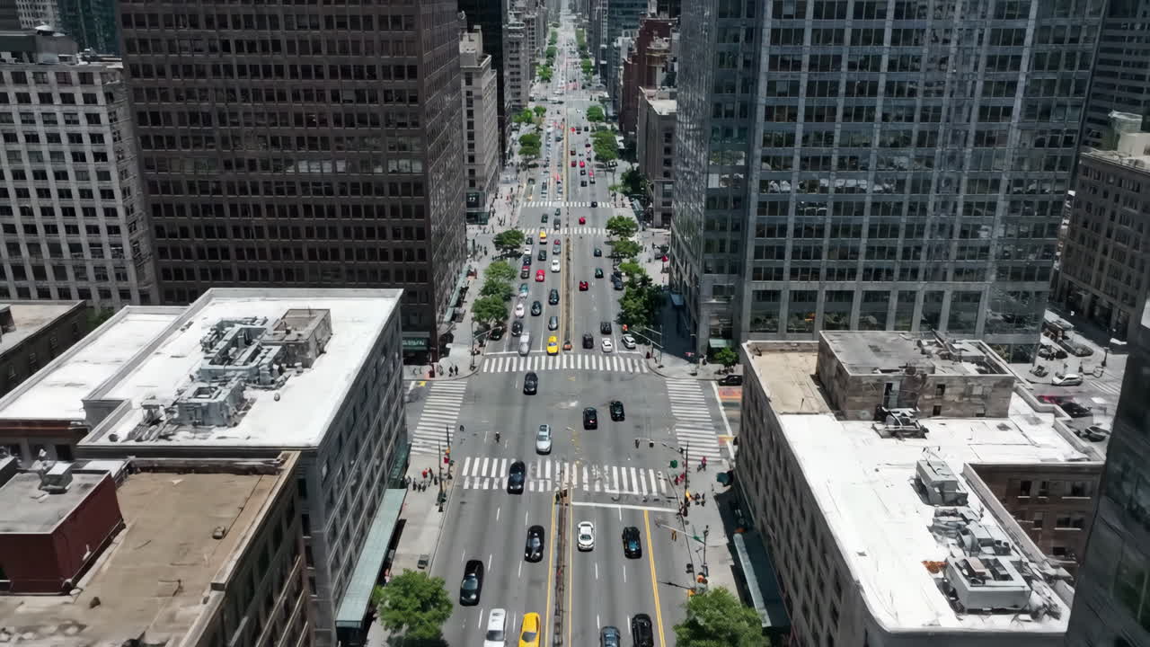 Aerial View of a Bustling City Street with Traffic and Skyscrapers