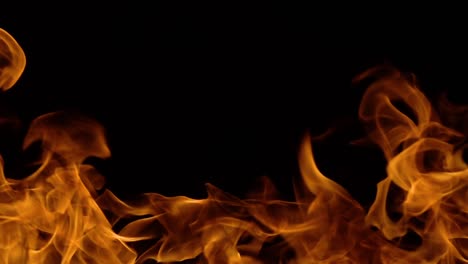 Flames-of-fire-on-black-background-in-slow-motion